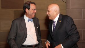 Richard Leibner laughing with a friend at the 2019 LABF Giants of Broadcasting luncheon